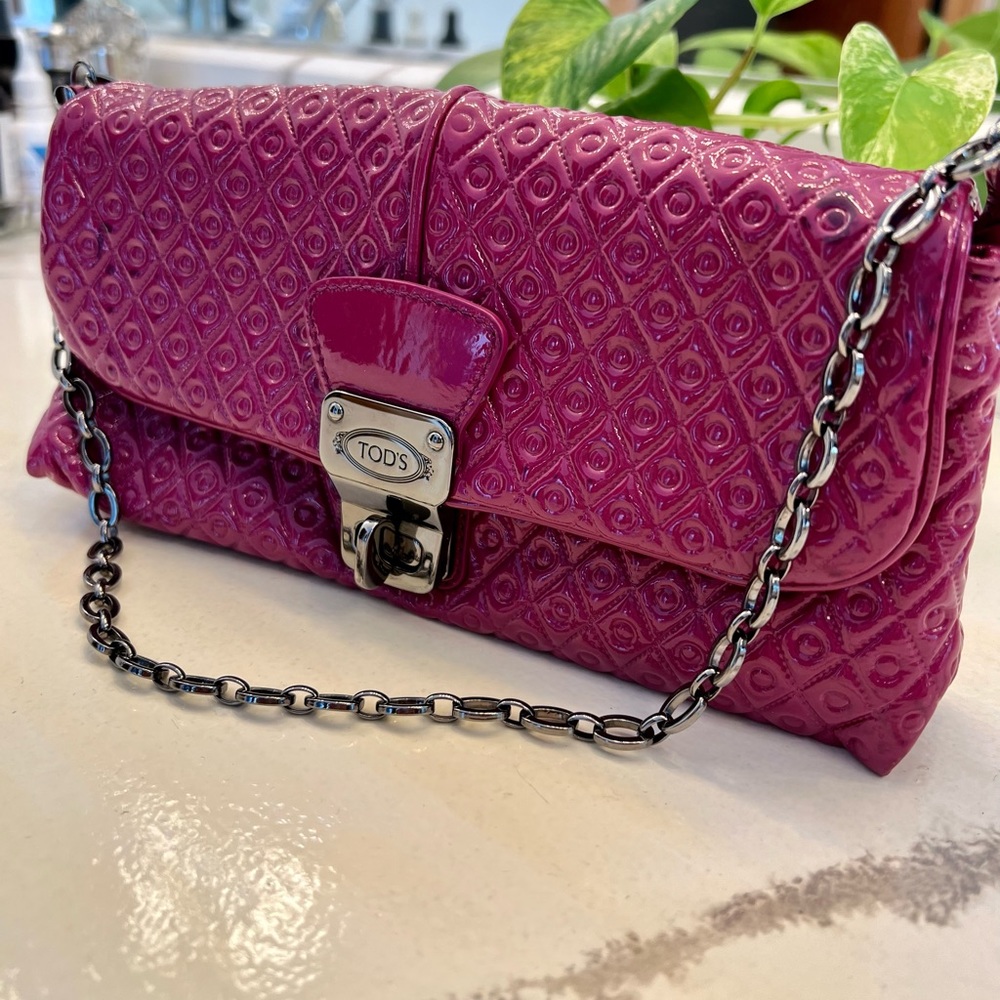 Tod’s Leather signature pink clutch. Great condition